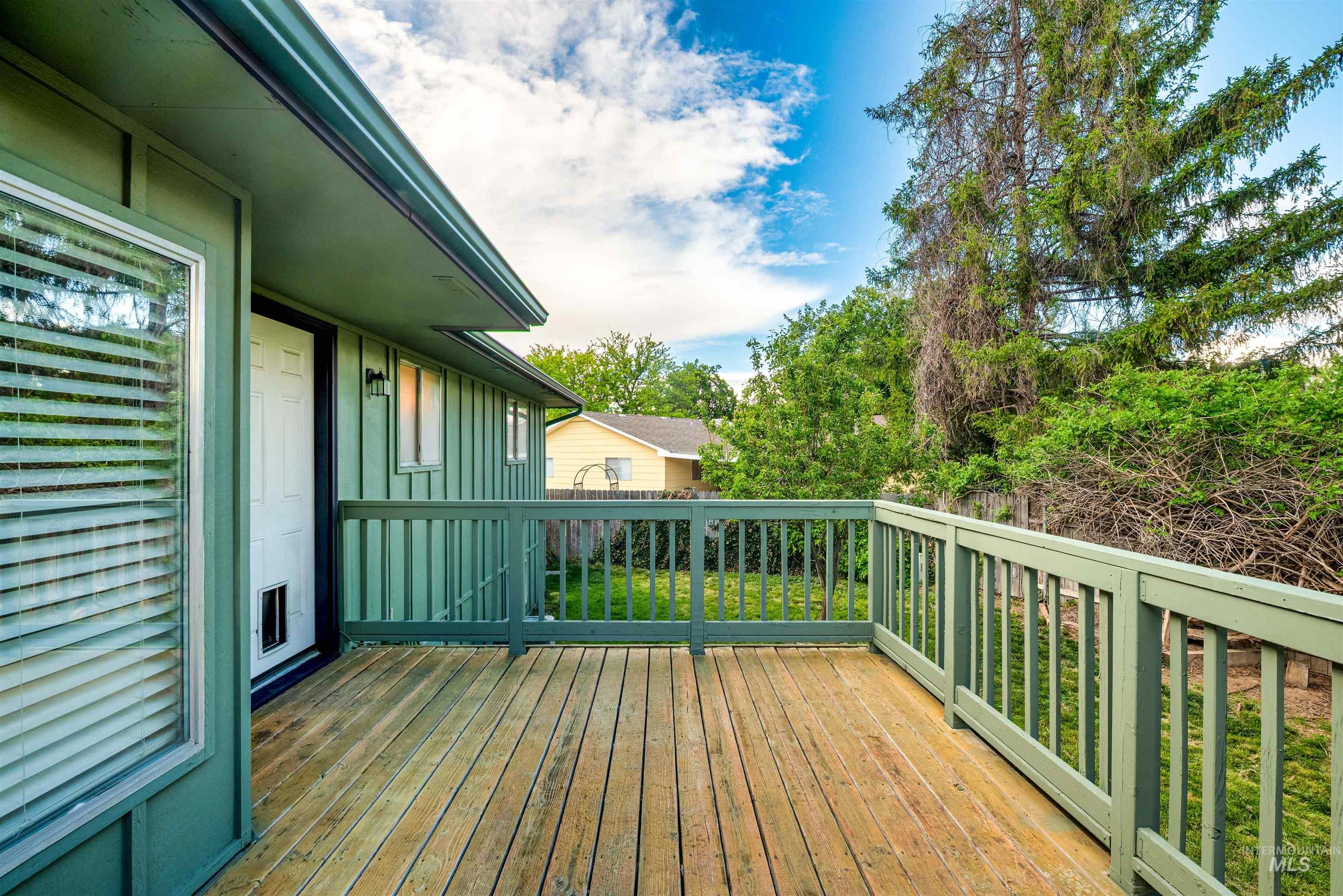 Deck featuring view of wooded area