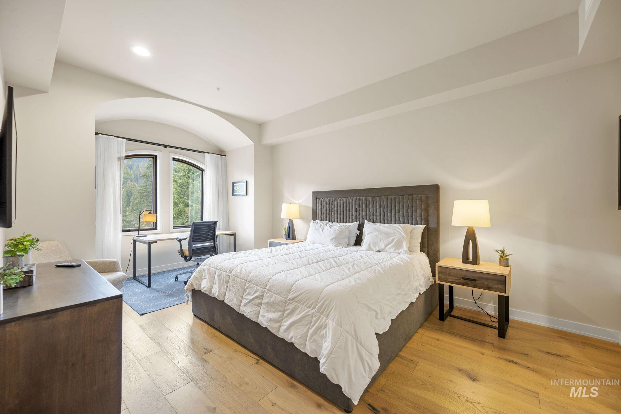 Bedroom featuring a desk, light wood-style floors, and recessed lighting