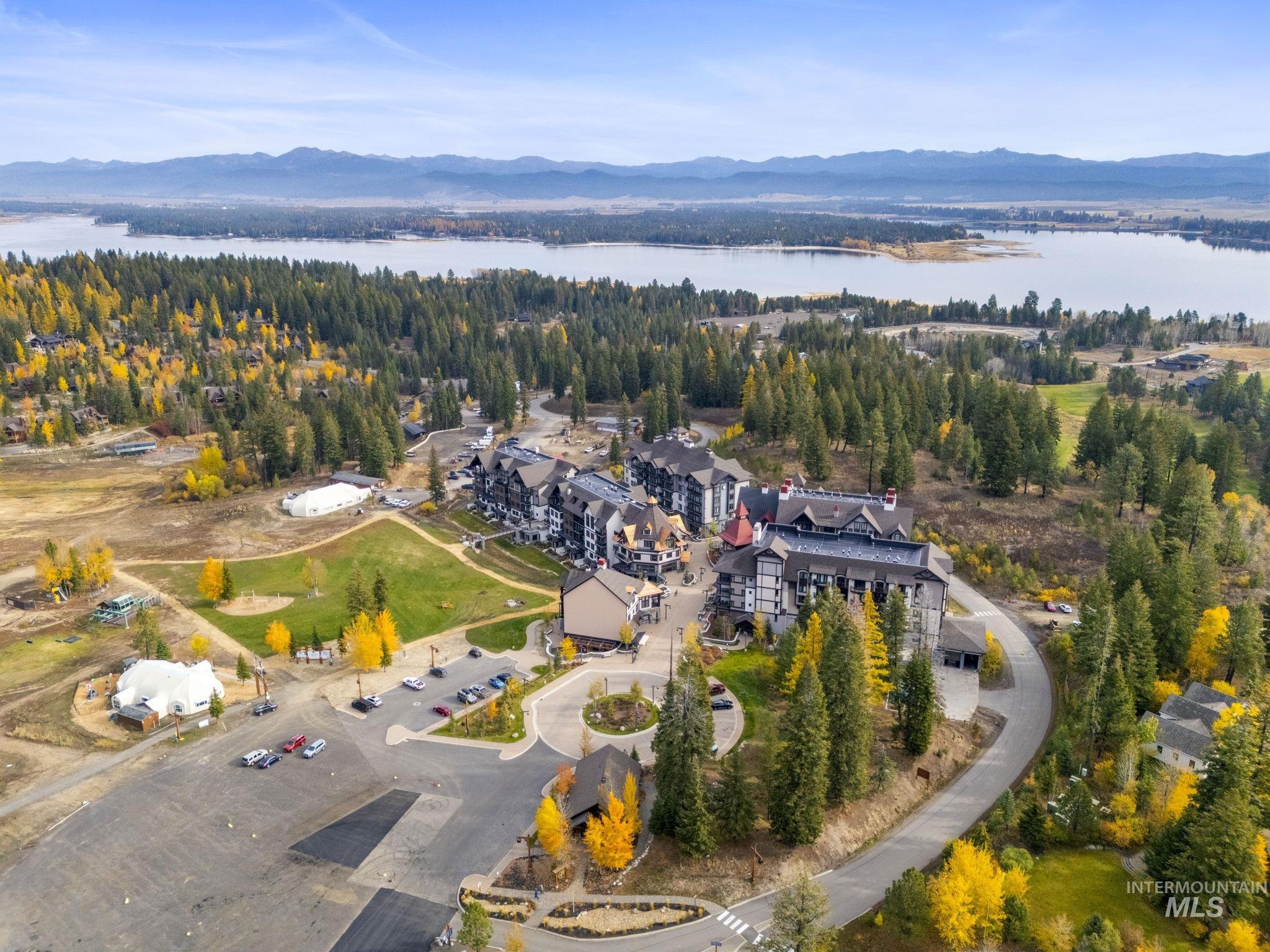 View of property location with a water and mountain view