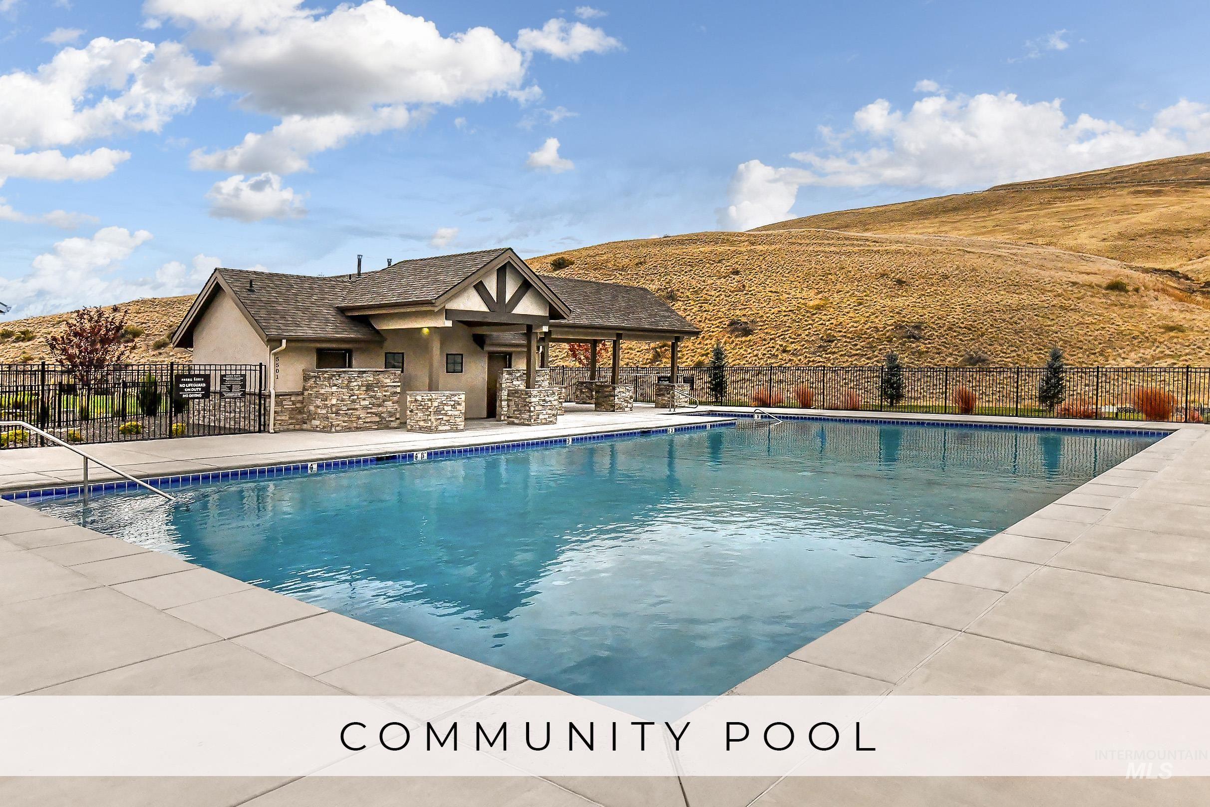View of pool featuring a mountain view and a patio