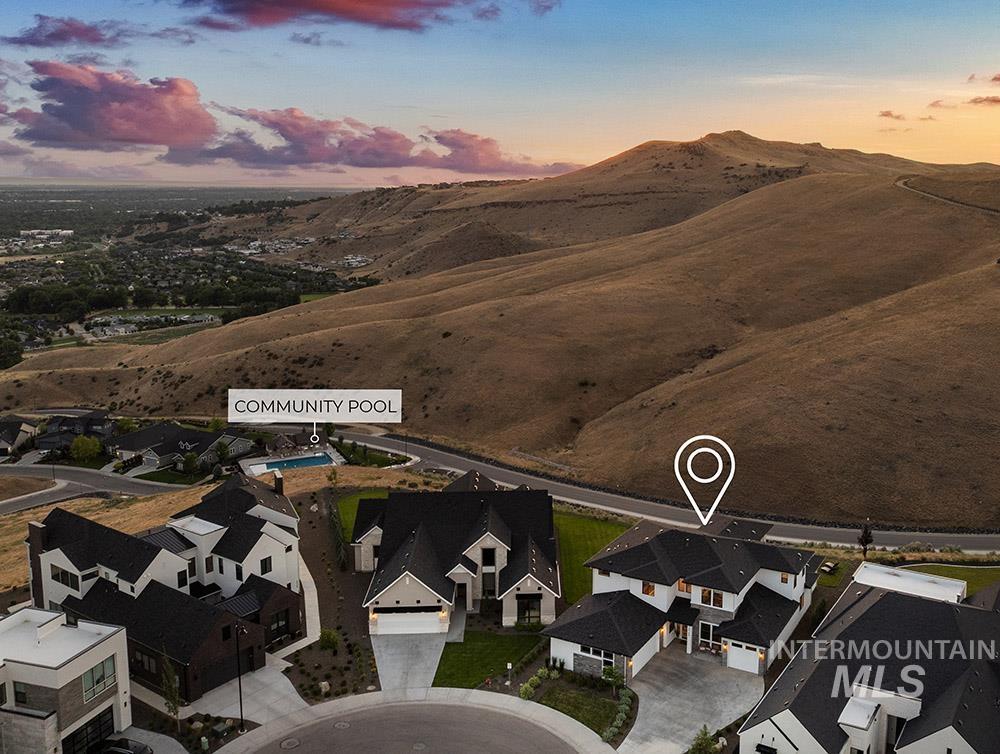 Aerial view of residential area featuring a mountainous background