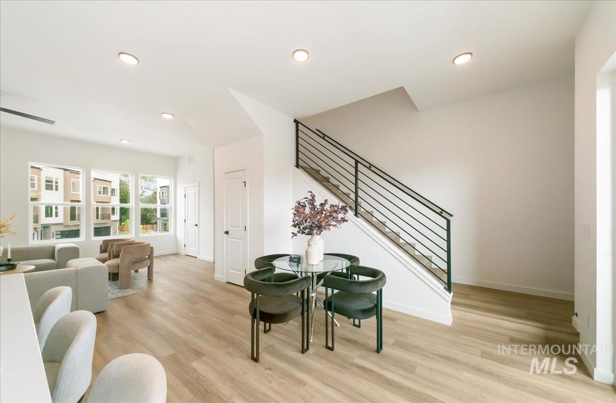 Sitting room featuring stairway, recessed lighting, and light wood-style floors