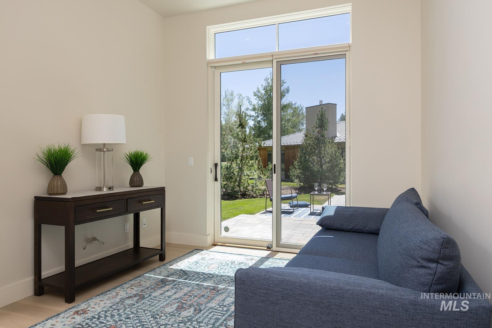 Entryway featuring wood finished floors and baseboards