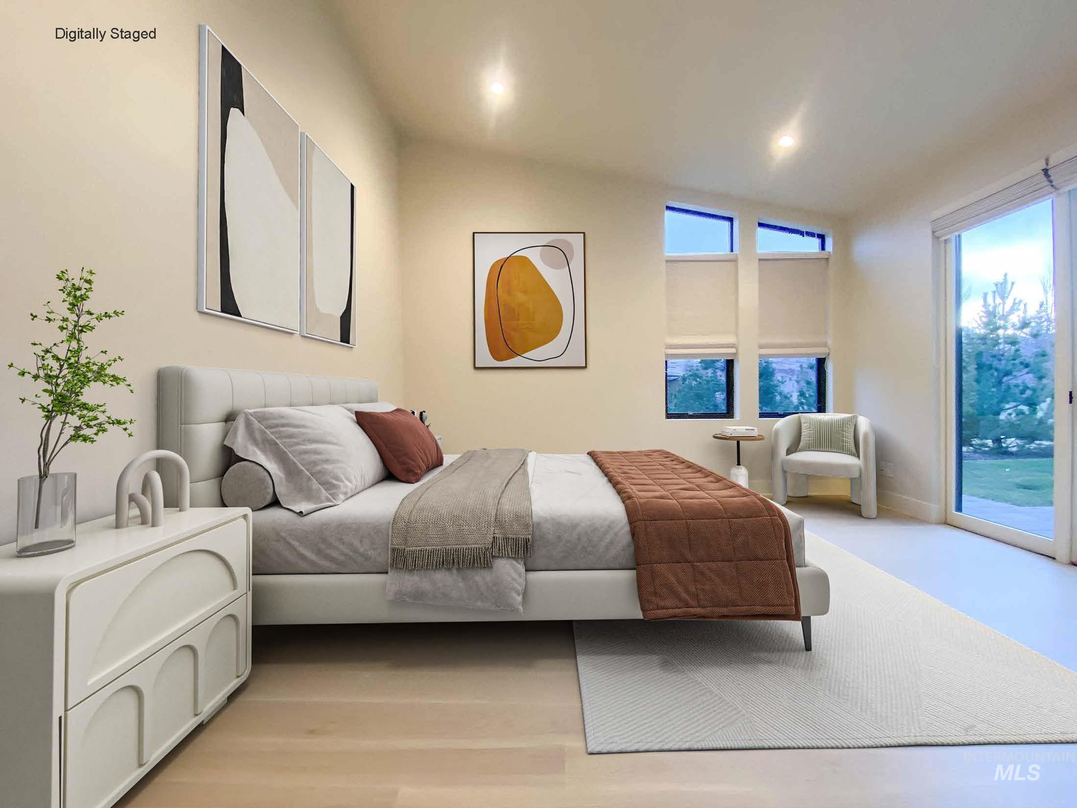 DIGITALLY STAGED - Bedroom featuring vaulted ceiling and access to exterior