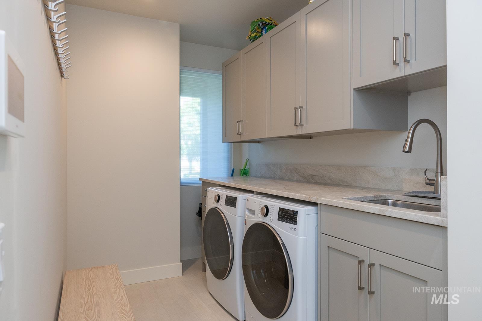 Washroom with independent washer and dryer and cabinet space