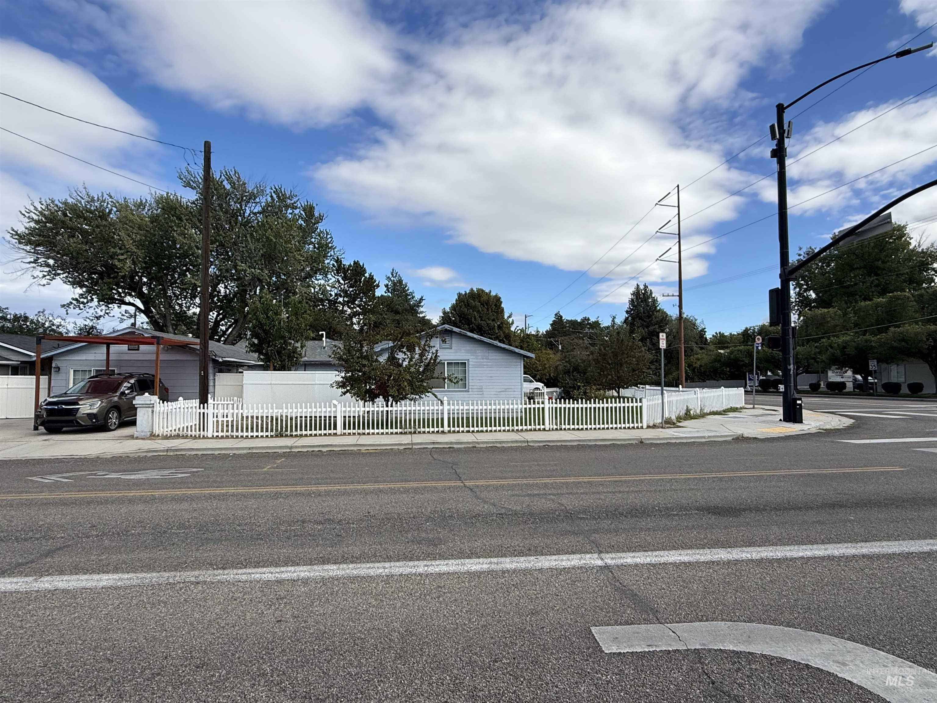 View of asphalt street with sidewalks and curbs