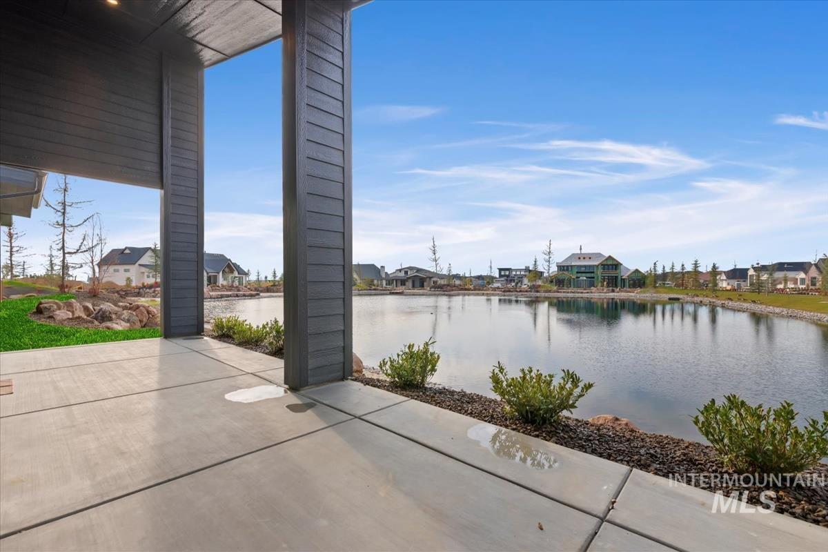 View of patio / terrace featuring a residential view and a water view