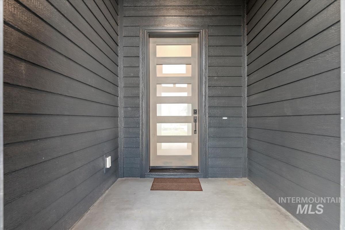 Doorway to property with a patio