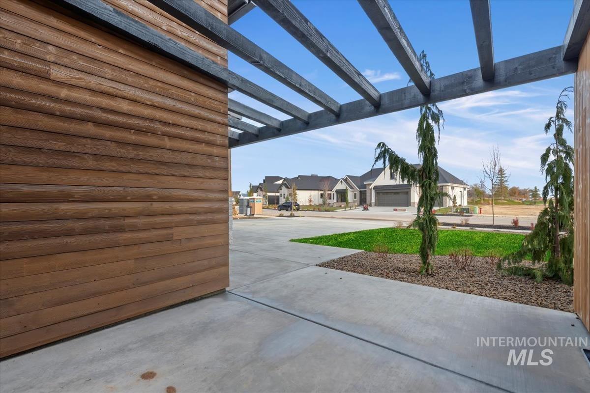 View of patio / terrace with a pergola and a residential view