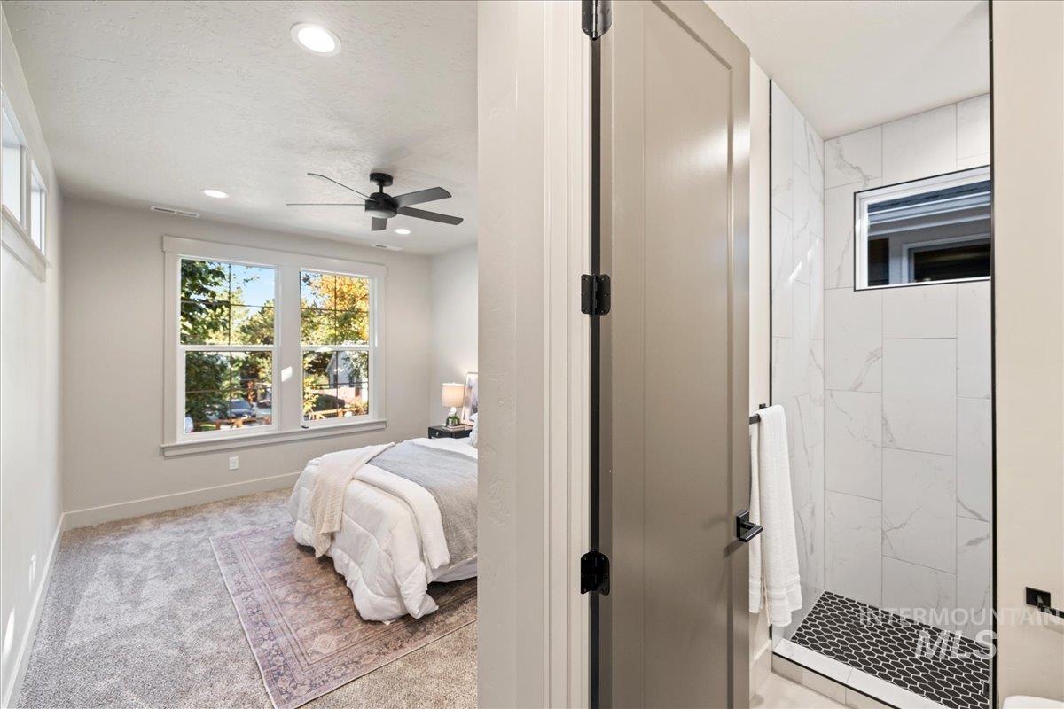 Bedroom with light colored carpet, recessed lighting, and ceiling fan