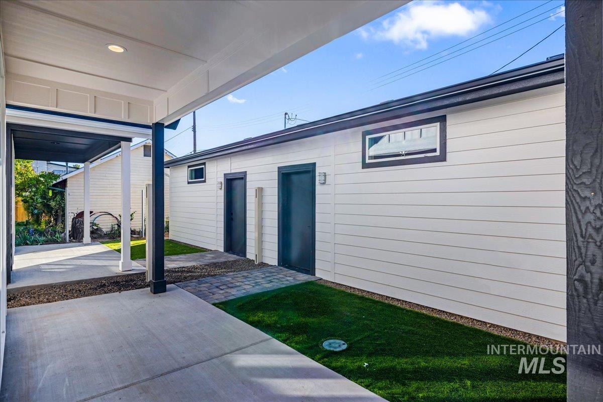 Property entrance featuring a lawn