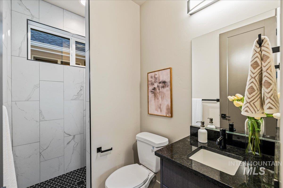 Bathroom featuring vanity and a shower stall