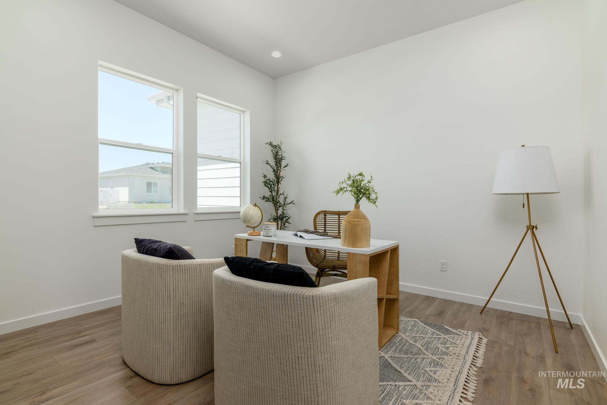 Living area with light wood-type flooring and a desk