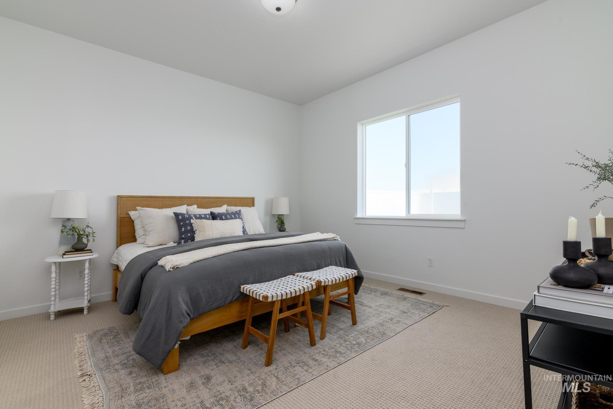 Carpeted bedroom with baseboards