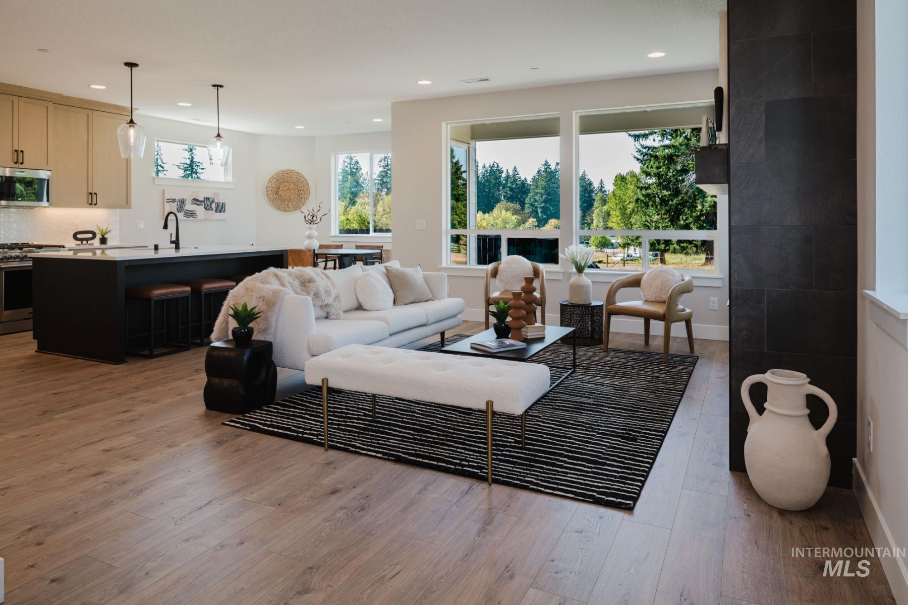 Living room featuring light wood-style floors and recessed lighting
