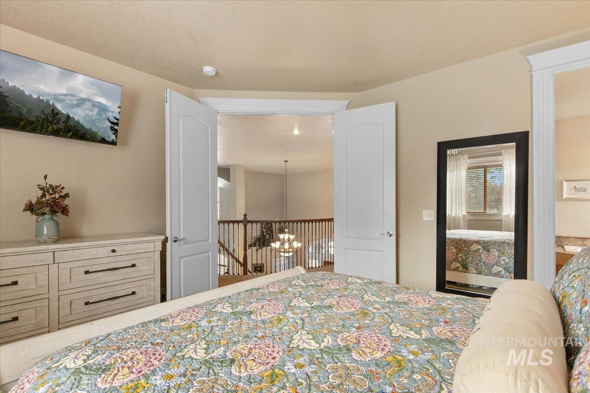Bedroom featuring a chandelier