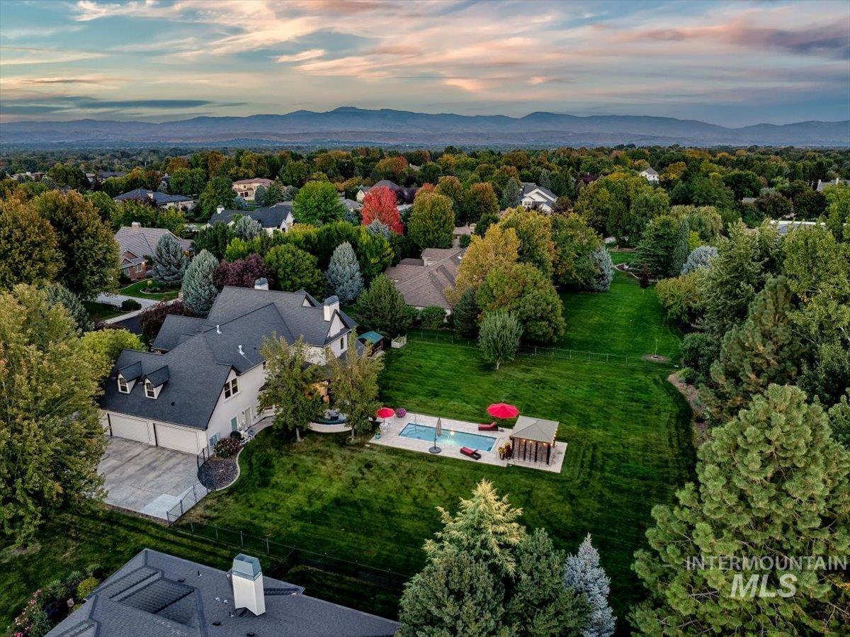 View of property location with a mountainous background and nearby suburban area