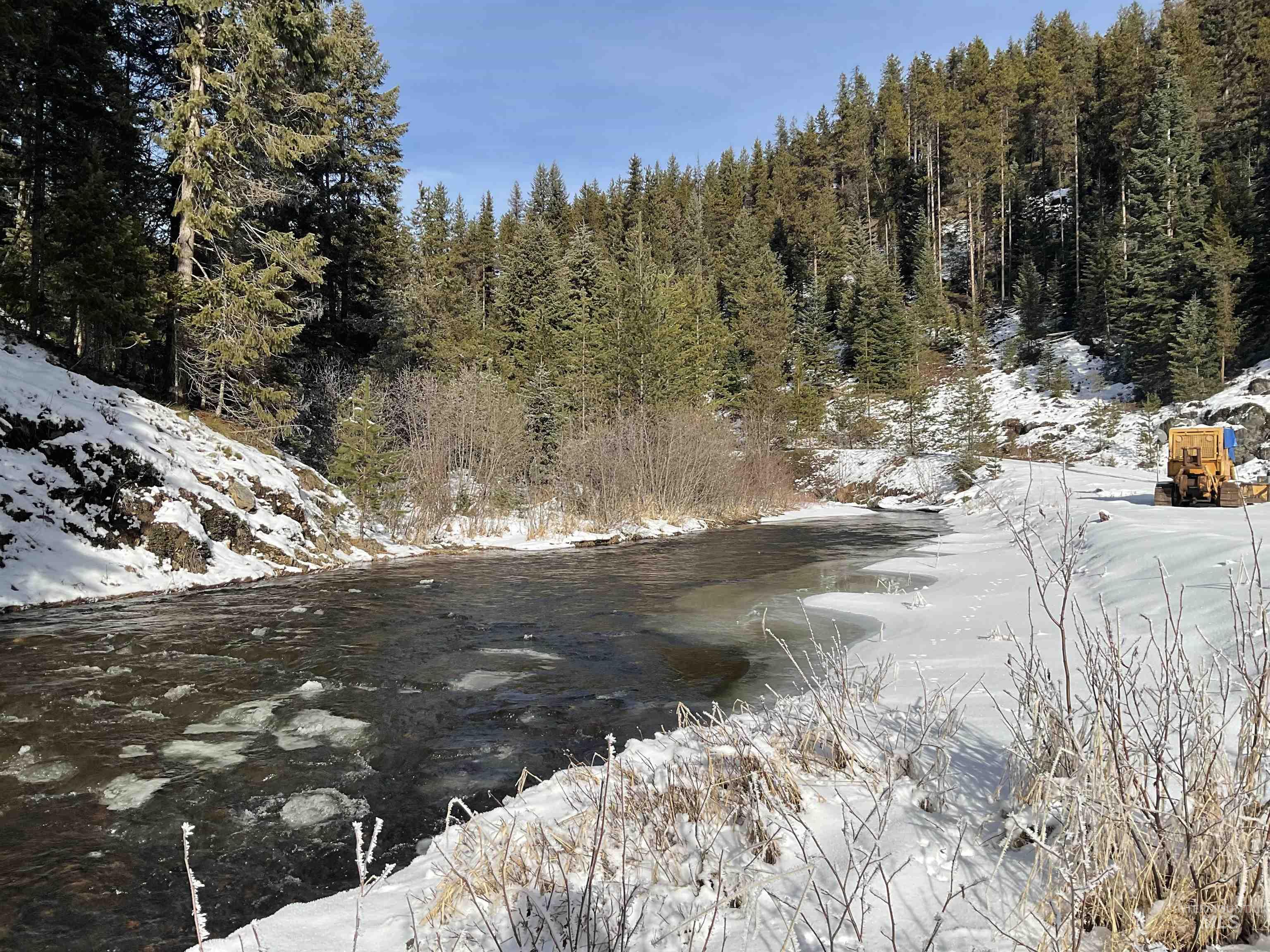 Snowy landscape with a water view
