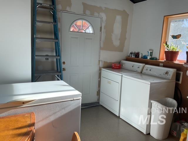 Washroom featuring separate washer and dryer