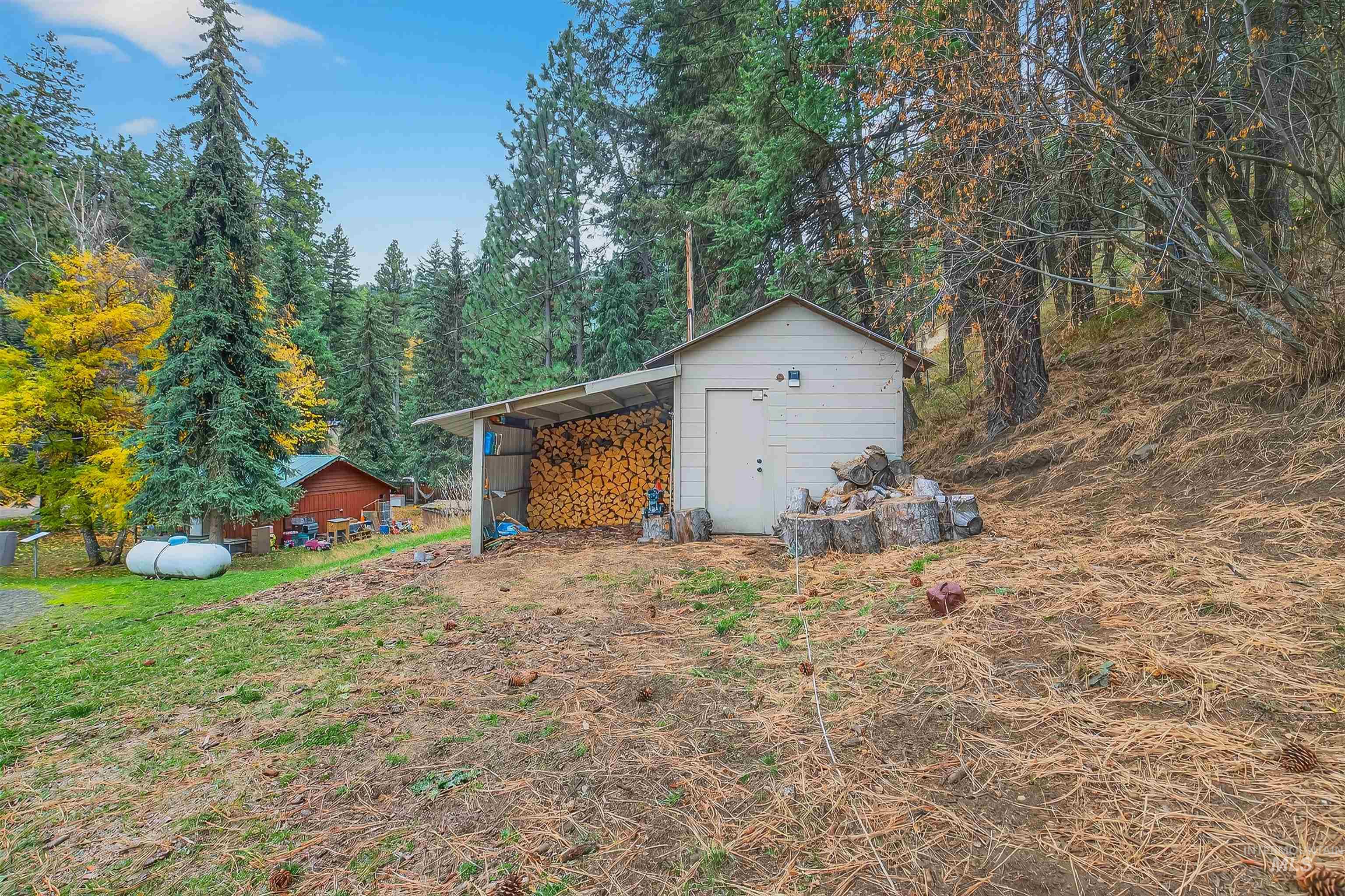 View of shed featuring a forest view