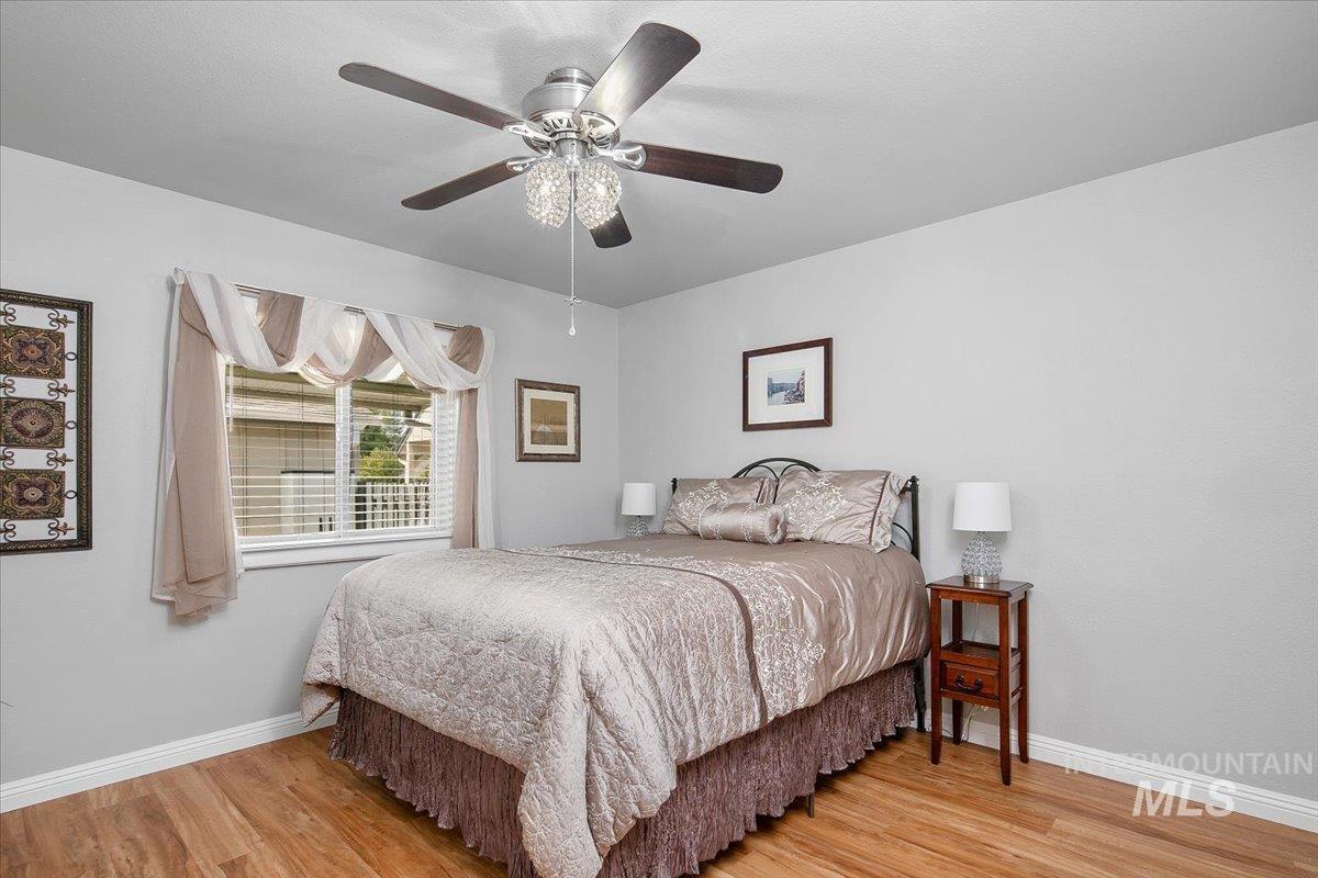 Bedroom featuring light wood finished floors and ceiling fan