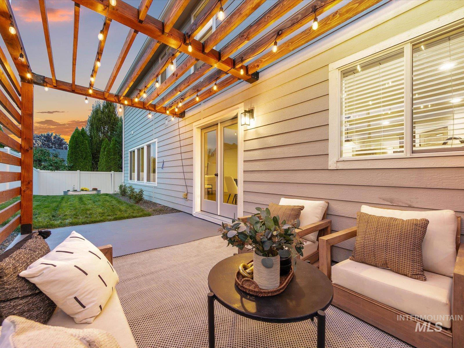 Patio terrace at dusk with a patio area and a pergola