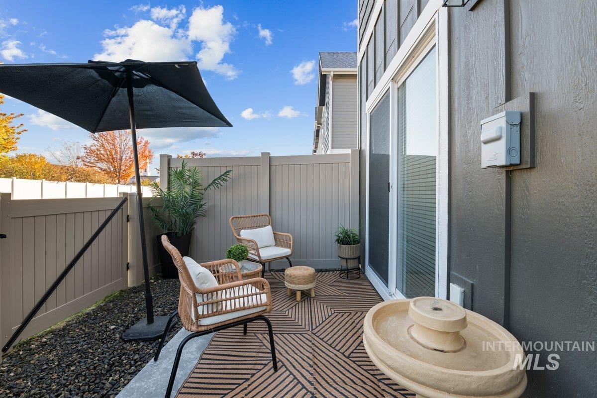 Fenced backyard featuring a gate