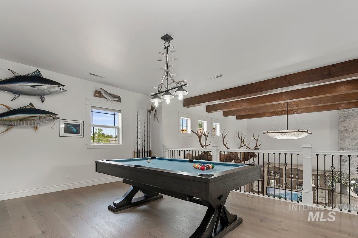 Rec room with light wood-type flooring, billiards table, and beam ceiling