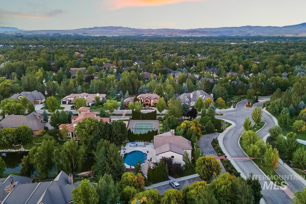 Aerial view at dusk of a mountain view and view of pool area