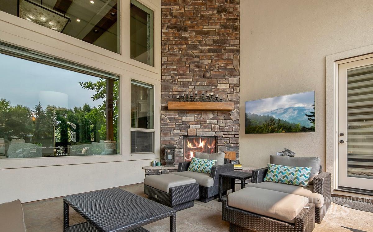 View of patio / terrace featuring an outdoor living space with a fireplace