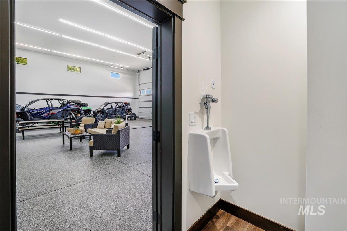 Bathroom featuring light aggregate flooring and baseboards