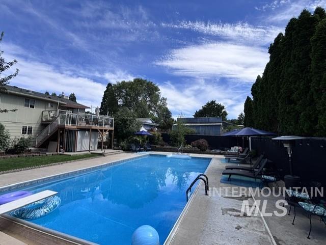 Outdoor swimming pool with concrete surround