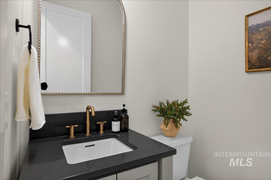 Bathroom featuring vanity and toilet