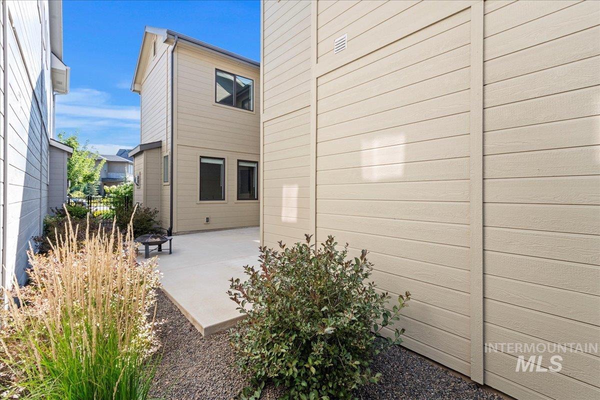 Rear view of house featuring a patio