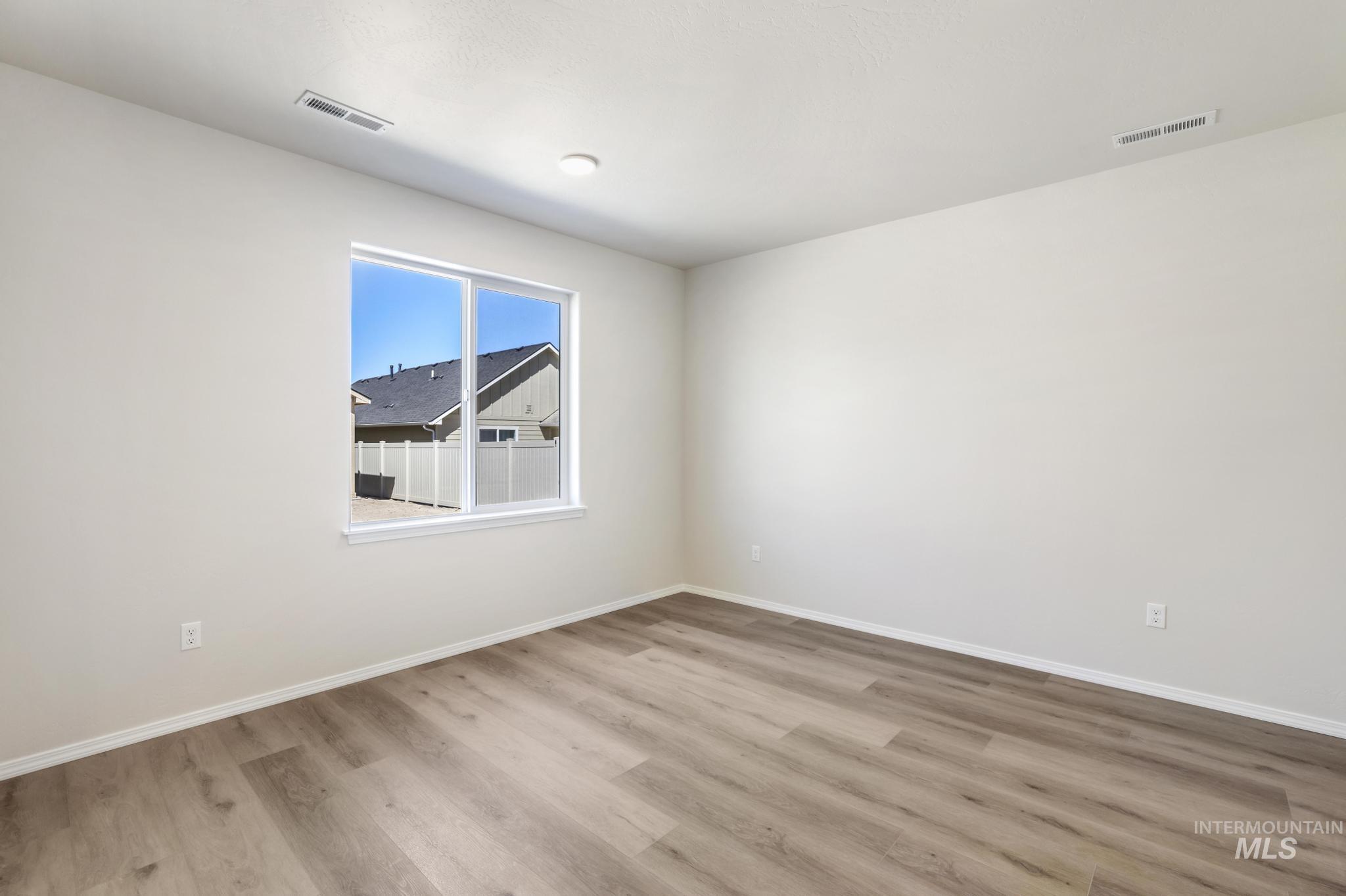 Unfurnished room with light wood-style flooring