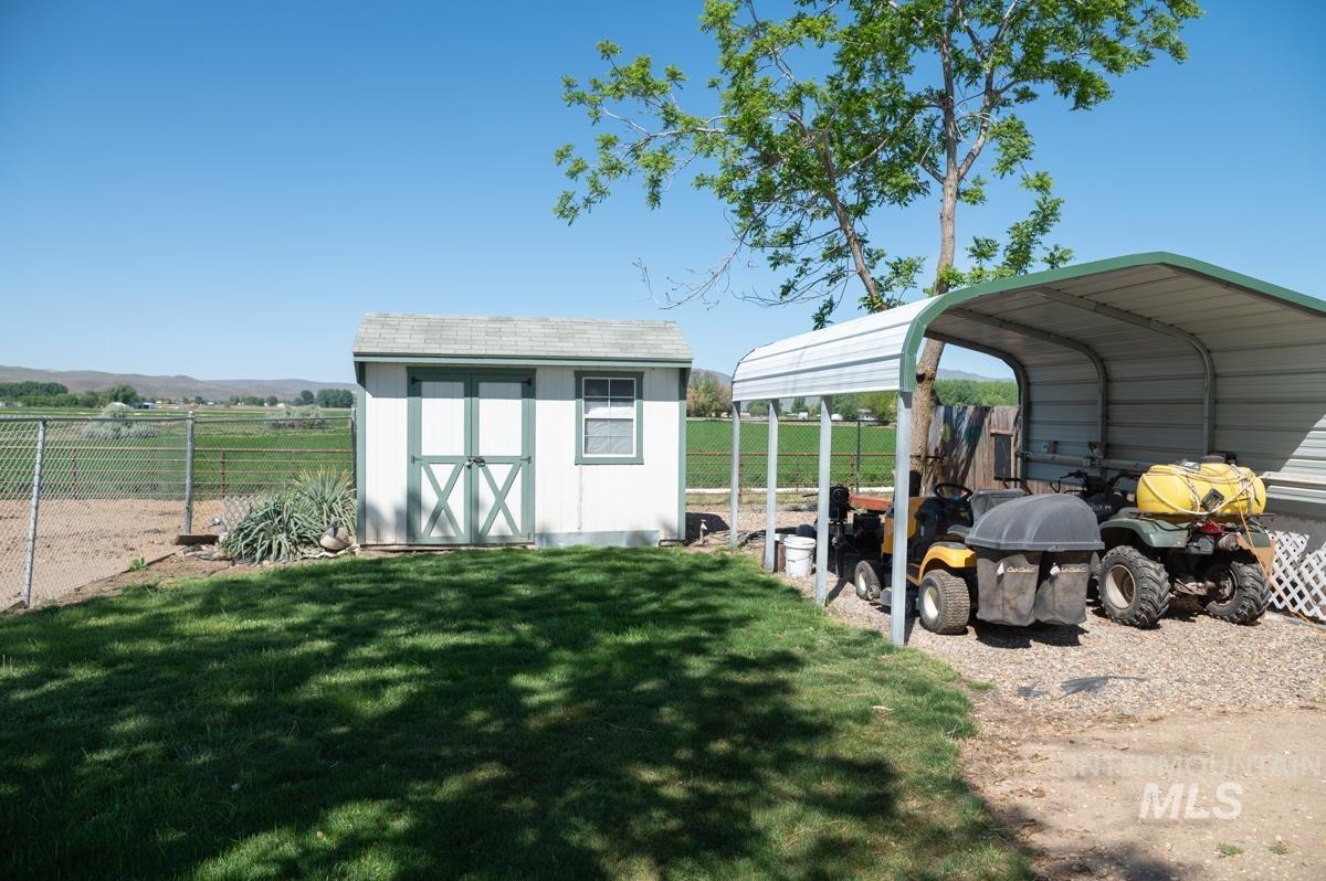 View of shed featuring a carport
