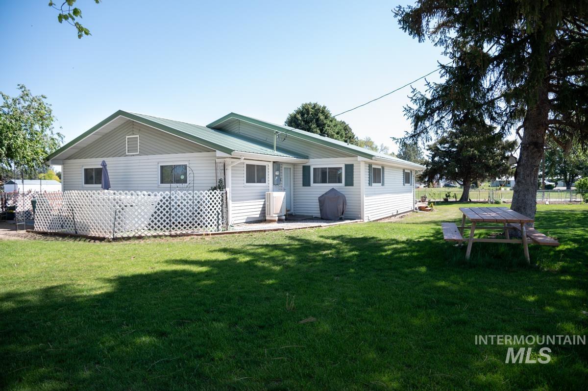 Rear view of house featuring a patio