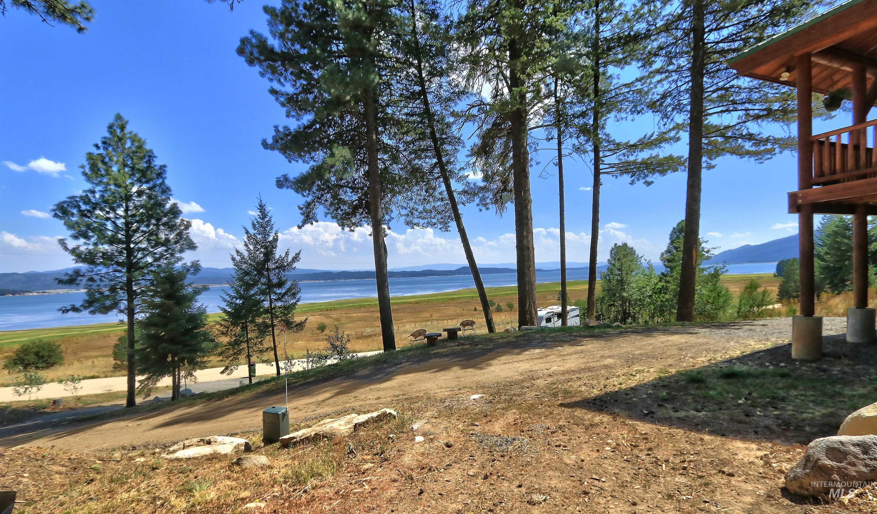 View of yard with a water and mountain view