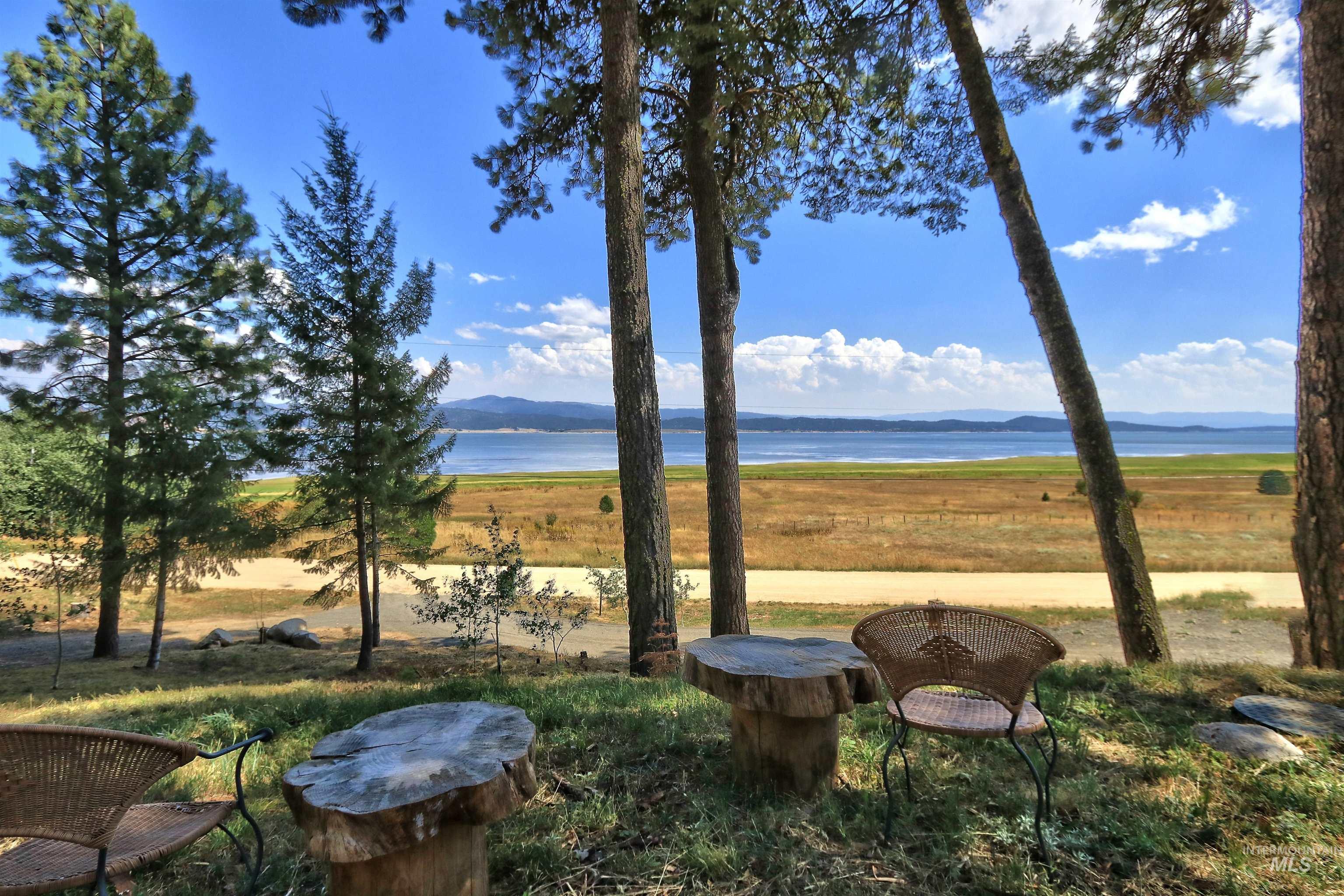 View of yard with a water and mountain view