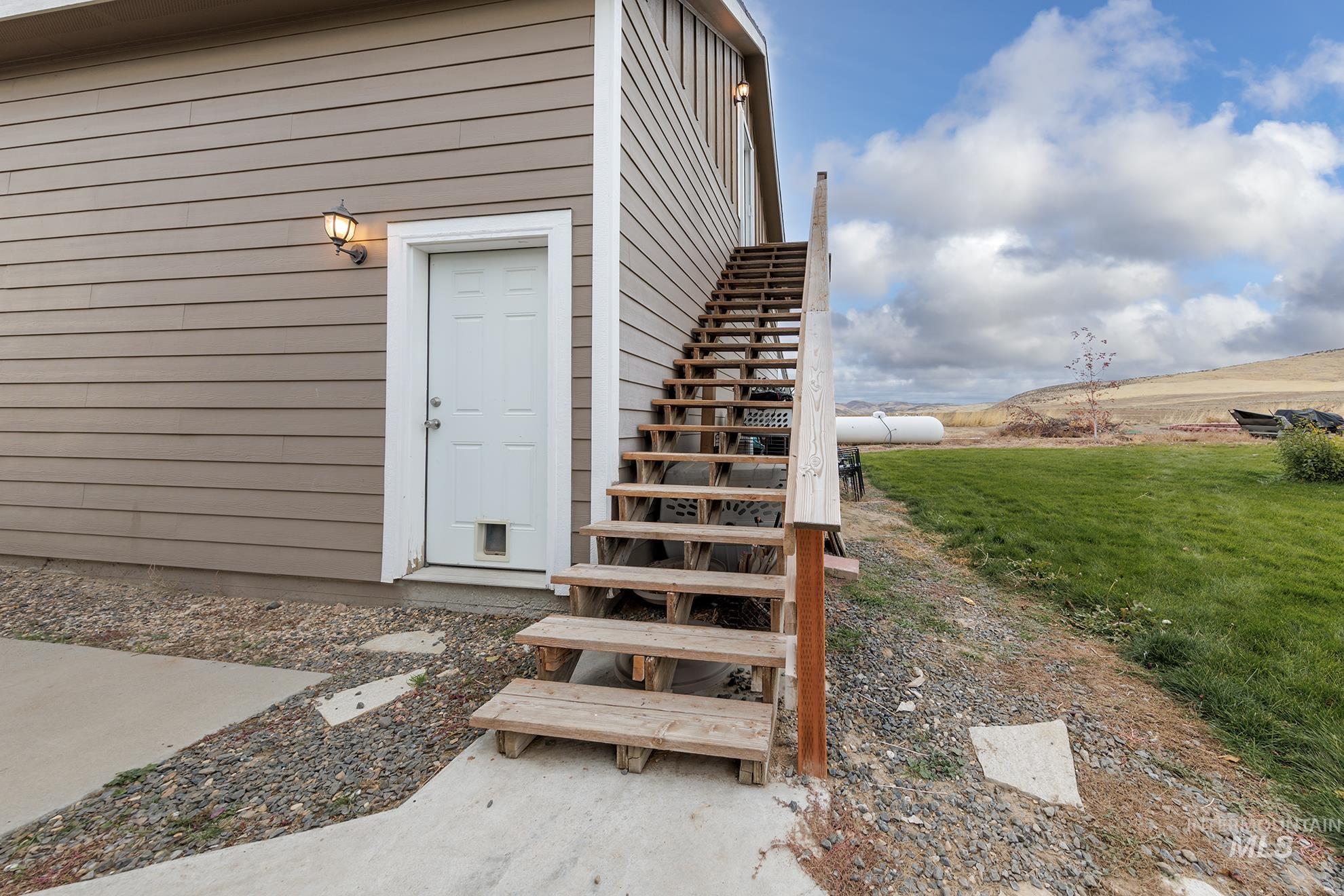 Property entrance with a yard
