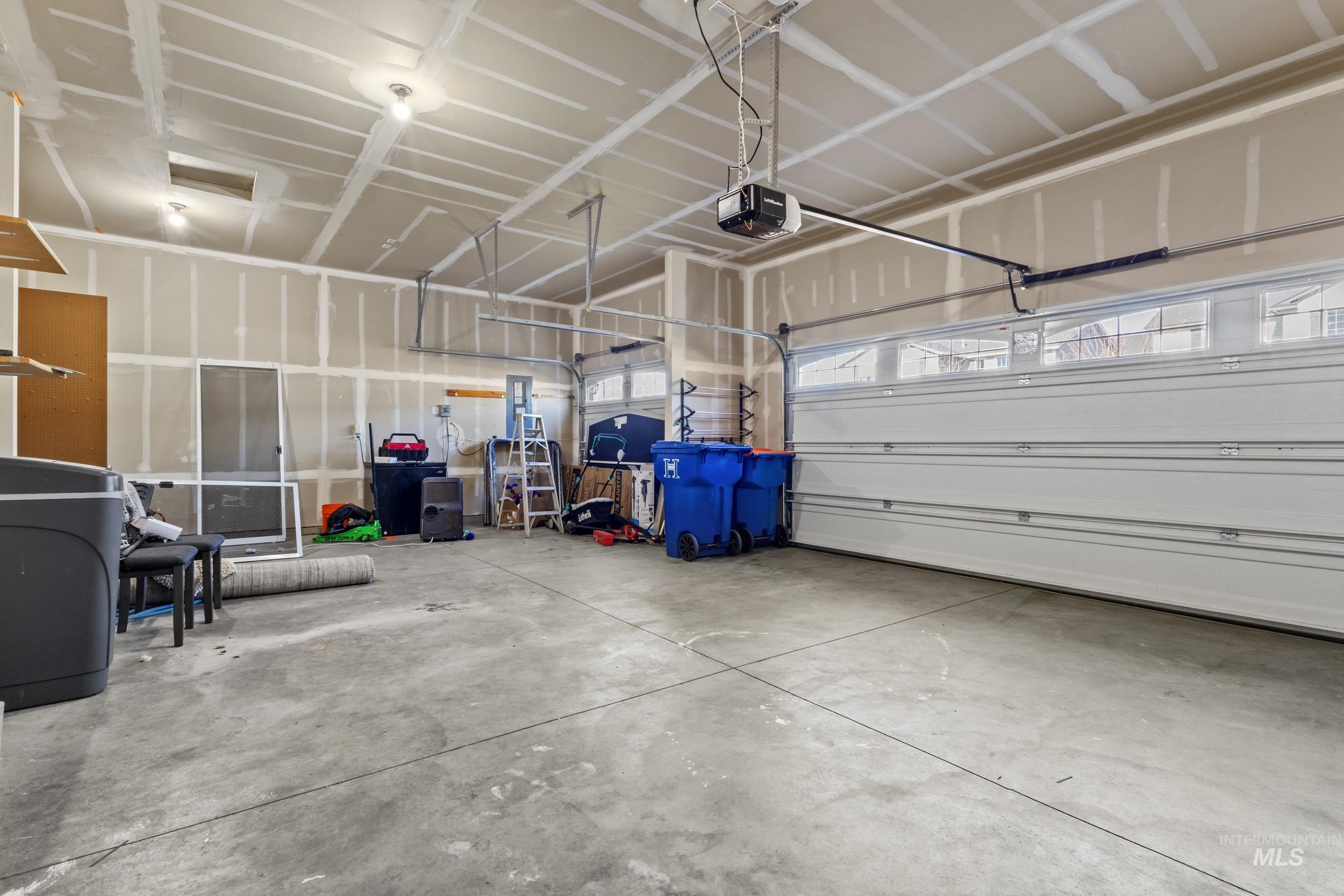 Garage featuring a garage door opener