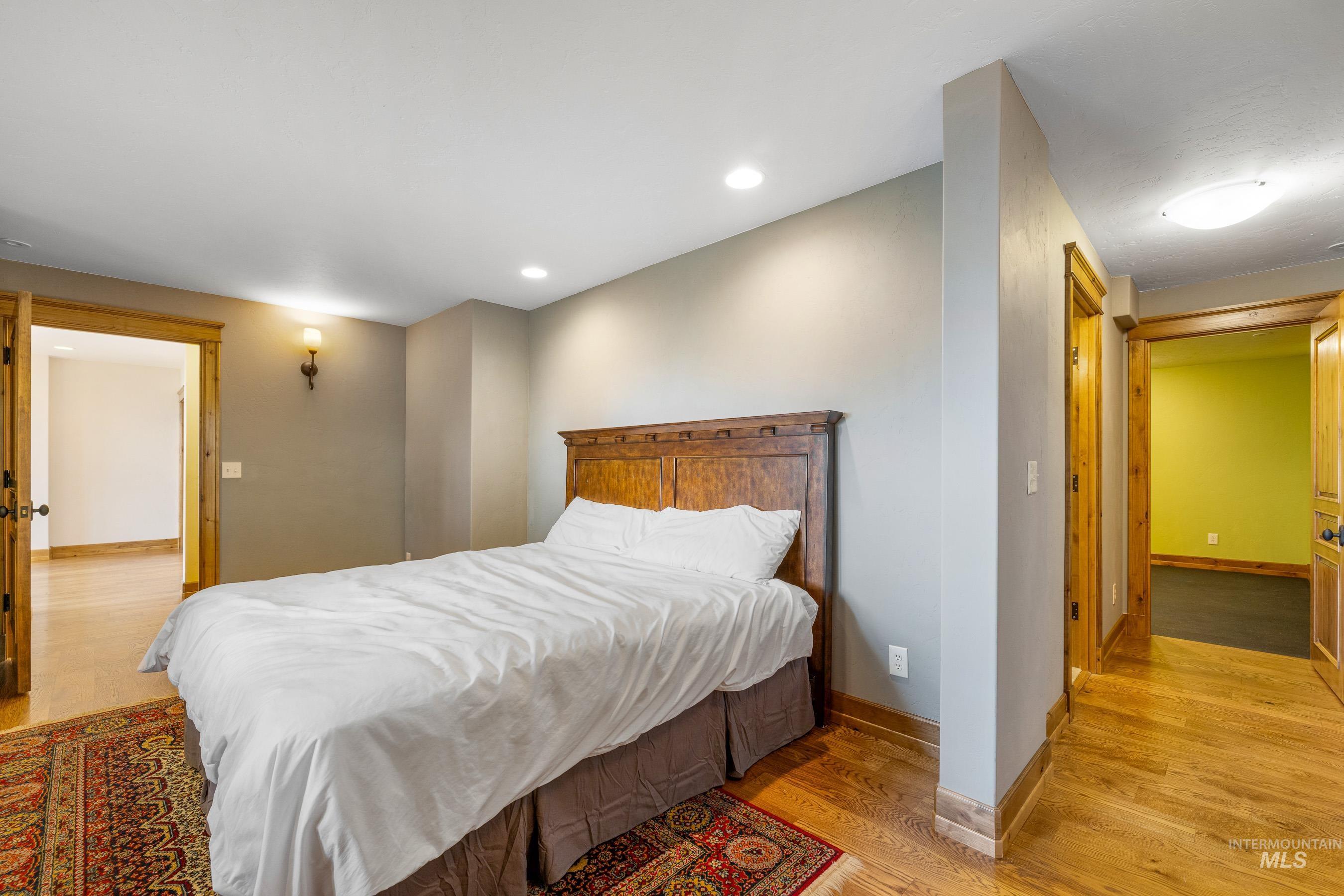 Bedroom featuring light wood-type flooring and recessed lighting