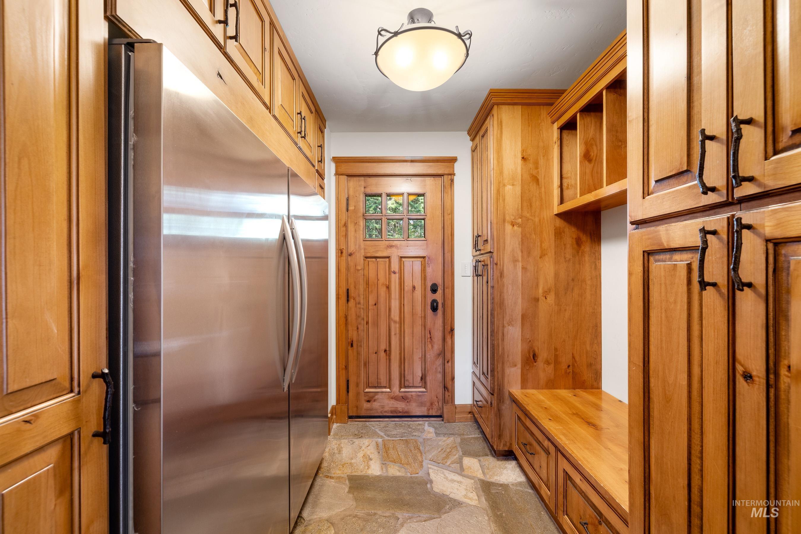 Mudroom with light stone finish flooring