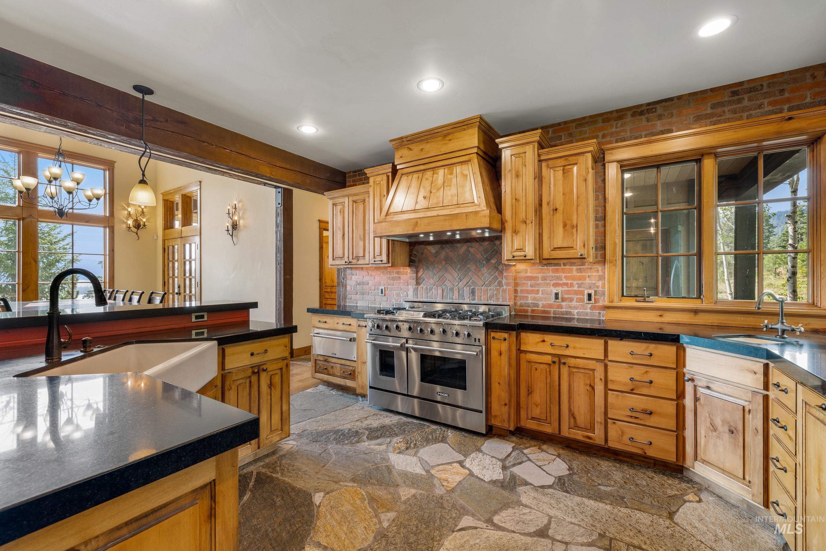 Kitchen with range with two ovens, backsplash, pendant lighting, recessed lighting, and a warming drawer