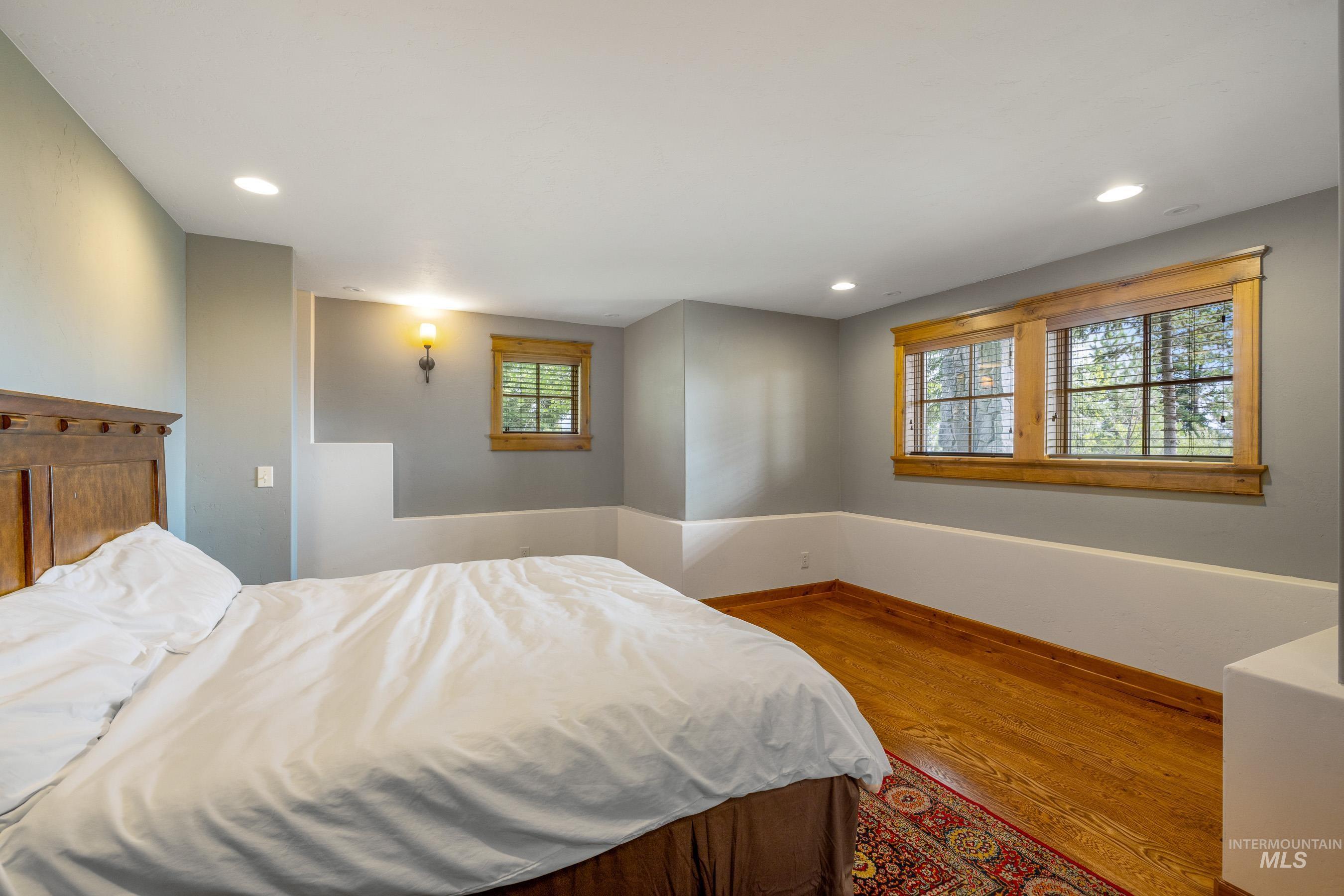 Bedroom featuring wood finished floors and recessed lighting