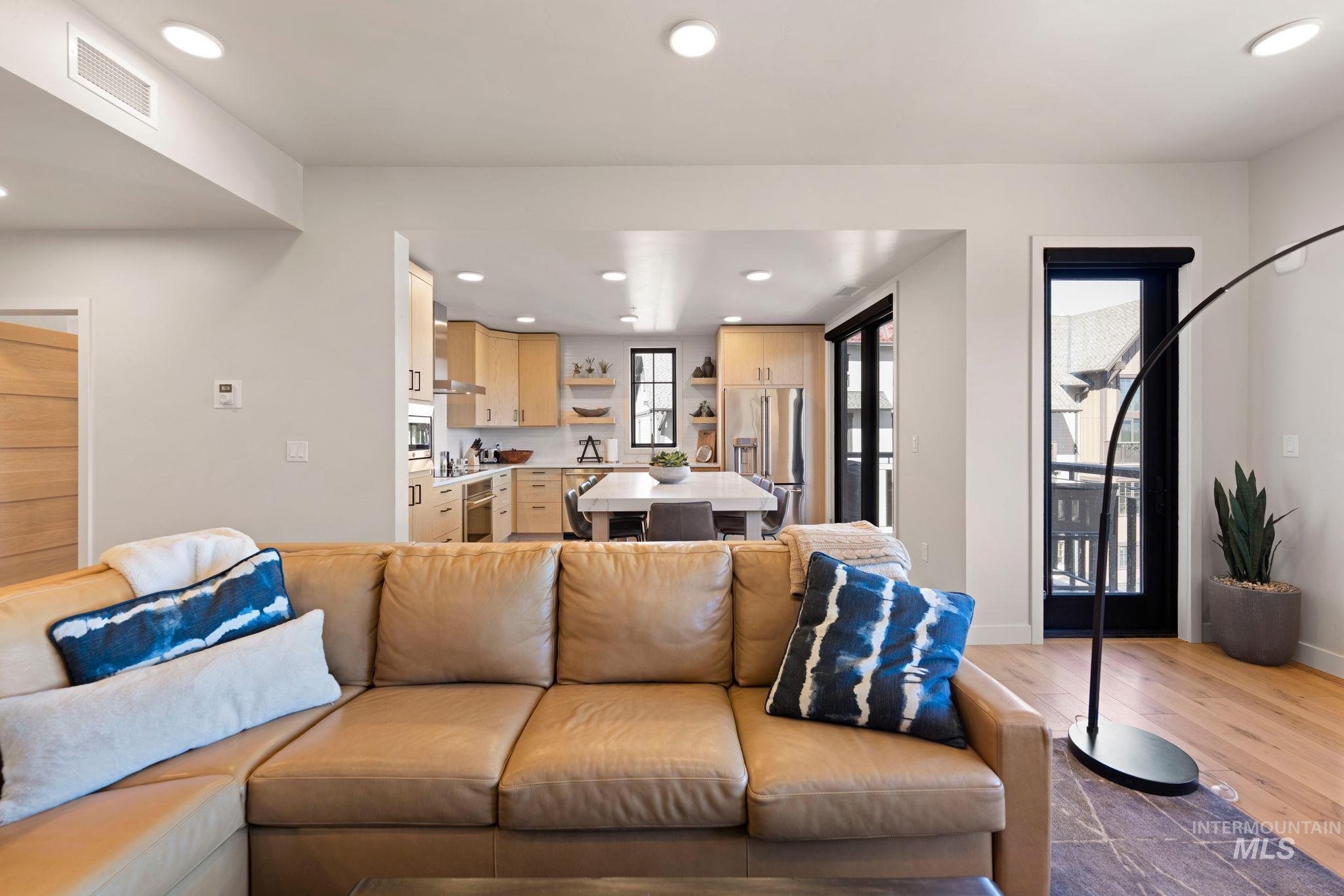 Living area featuring recessed lighting and light wood-style flooring