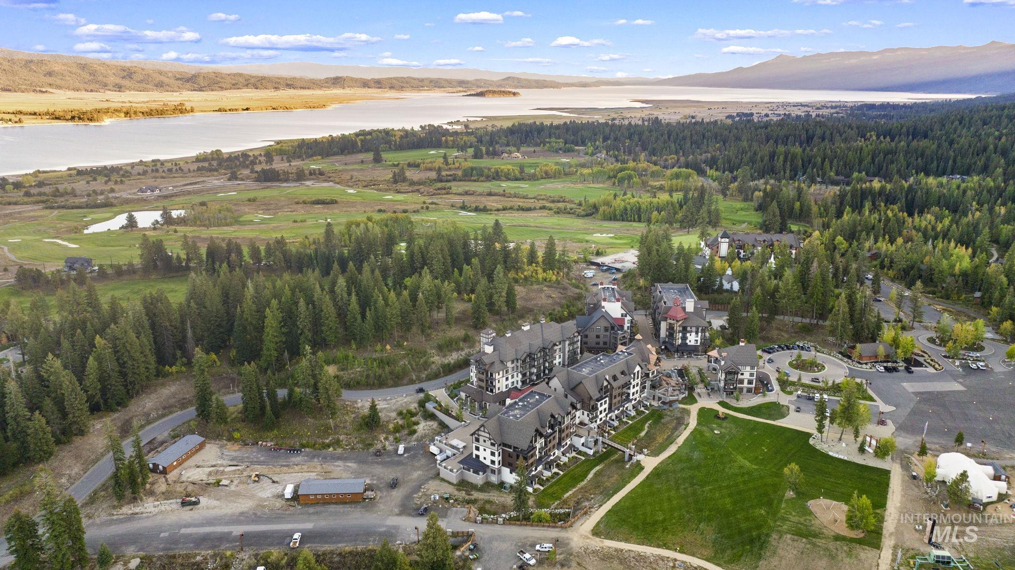 Aerial view of property's location featuring a large body of water