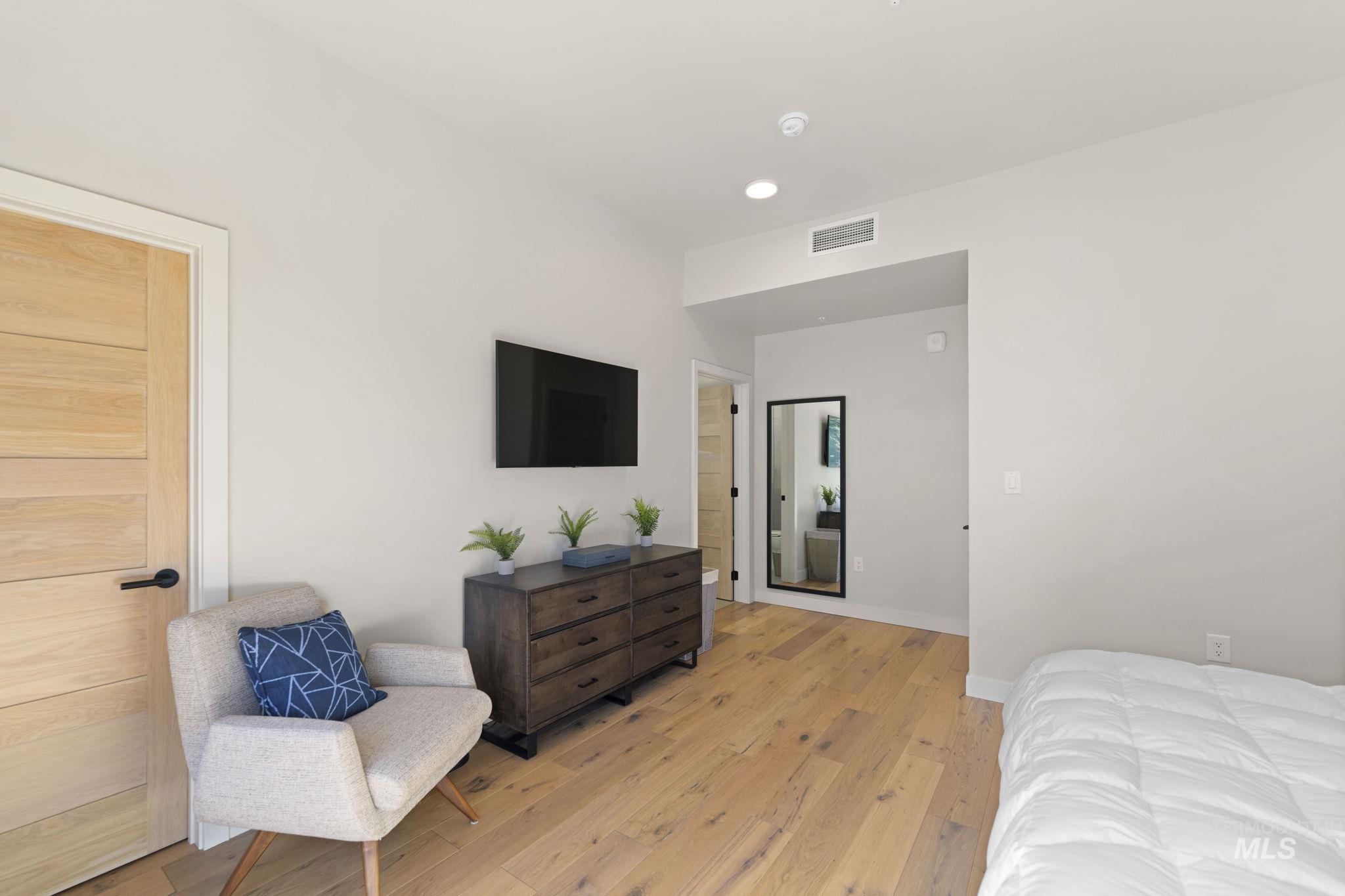 Bedroom featuring light wood finished floors and recessed lighting