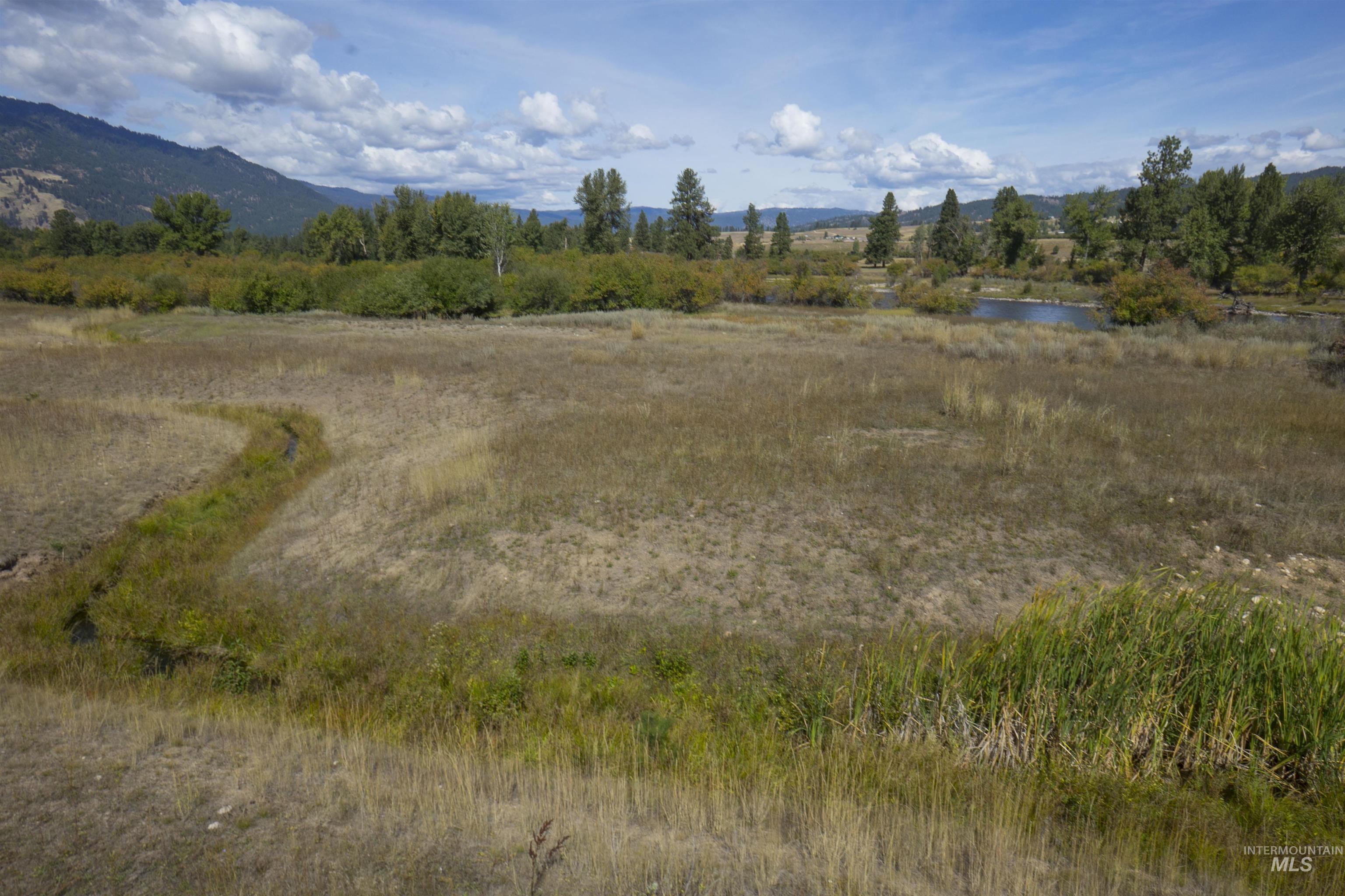 View of nature with rural landscape and a water and mountain view