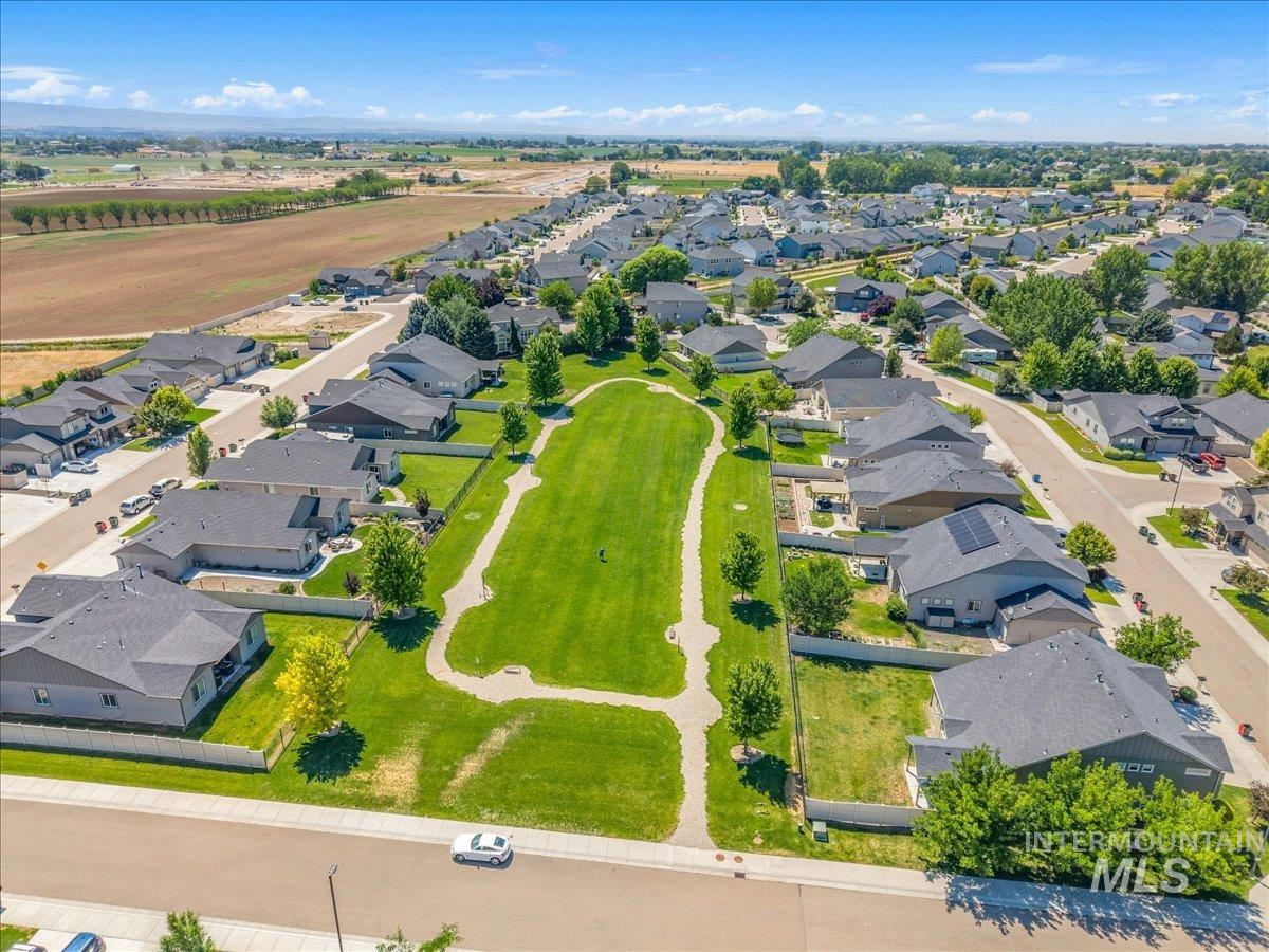 Expansive residential neighborhood featuring a central green space with walking paths